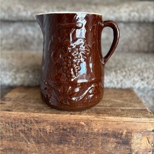 Brown Glazed Ceramic Pitcher with Grape Motif